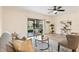Comfortable living room area with neutral decor, plenty of sunlight and sliding door access to patio at 1575 Downy Birch Ln, Longwood, FL 32750