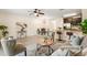 Cozy living room and eat-in kitchen combination with breakfast bar seating, ceiling fan, and lots of light at 1575 Downy Birch Ln, Longwood, FL 32750