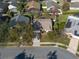 An aerial view captures the home's curb appeal in a landscaped neighborhood at 1662 Canoe Creek Rd, Oviedo, FL 32766