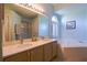 The primary bathroom features a double vanity, soaking tub, and natural light at 1662 Canoe Creek Rd, Oviedo, FL 32766