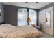 This bedroom features a cozy atmosphere with light-filtering curtains at 1662 Canoe Creek Rd, Oviedo, FL 32766