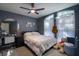 A cozy bedroom features decor, natural light, and a ceiling fan at 1662 Canoe Creek Rd, Oviedo, FL 32766