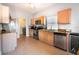 Well-equipped kitchen featuring stainless steel appliances, a window over the sink, and tile floors at 1662 Canoe Creek Rd, Oviedo, FL 32766