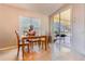 Breakfast nook featuring a table and chairs with view to the lanai and backyard at 1662 Canoe Creek Rd, Oviedo, FL 32766