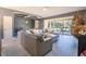 Comfortable living room with a large sectional sofa, backyard views, and modern gray walls at 1662 Canoe Creek Rd, Oviedo, FL 32766