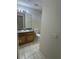 Standard bathroom featuring a vanity with storage, a toilet, a mirror, and a tile floor at 1868 Hammock Moss Dr, Orlando, FL 32820