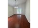 Dining room with hardwood floors, chandelier and glass patio doors to backyard at 1868 Hammock Moss Dr, Orlando, FL 32820