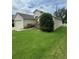 Lovely home featuring a well-maintained lawn, tidy landscaping and a white picket fence enhancing curb appeal at 1868 Hammock Moss Dr, Orlando, FL 32820