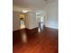 Inviting living space featuring beautiful floors and seamless flow into the kitchen and dining areas at 1868 Hammock Moss Dr, Orlando, FL 32820