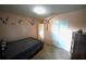 Calm bedroom with a gray bedspread, carpet, and light pink walls enhanced by decorative wall art at 208 Oleander St, Winter Haven, FL 33881
