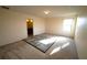 Bedroom featuring carpet flooring, neutral wall colors, an overhead light, and a connecting bathroom at 208 Oleander St, Winter Haven, FL 33881
