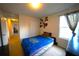Comfortable bedroom with a University of Florida themed bedspread and carpeted floors at 208 Oleander St, Winter Haven, FL 33881