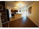 Open floorplan kitchen area featuring an island, tile floors, and modern cabinetry and appliances at 208 Oleander St, Winter Haven, FL 33881