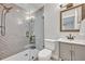 Bathroom featuring walk-in shower with stylish tile, vanity, and updated fixtures at 2112 Fosgate Dr, Winter Park, FL 32789