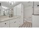 Bright bathroom with marble countertops, hexagon floors, and a glass-enclosed shower at 2112 Fosgate Dr, Winter Park, FL 32789