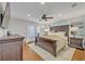 Cozy bedroom with hardwood floors, shutters, and a ceiling fan at 2112 Fosgate Dr, Winter Park, FL 32789