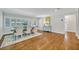 The dining room has wood floors, shuttered windows, and an elegant blue accent console table at 2112 Fosgate Dr, Winter Park, FL 32789