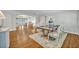 Elegant dining room with hardwood floors, a large rug, and a table set for six at 2112 Fosgate Dr, Winter Park, FL 32789