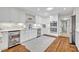 Updated kitchen boasts white cabinets, stainless steel appliances, and a beverage cooler at 2112 Fosgate Dr, Winter Park, FL 32789