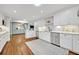 This modern kitchen features white cabinets, a wine fridge, and an open design at 2112 Fosgate Dr, Winter Park, FL 32789