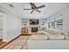 Comfortable living room with a brick fireplace, built-in shelves, and large sectional sofa at 2112 Fosgate Dr, Winter Park, FL 32789