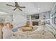 Spacious living room featuring a brick fireplace, a large sectional sofa, and hardwood floors at 2112 Fosgate Dr, Winter Park, FL 32789