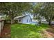 Well maintained backyard and exterior view of the home with a large pool at 222 Imperial Ridge Ct, Oviedo, FL 32765