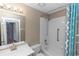 Bathroom with a shower/tub combo, sink, mirror, and a large shower curtain at 222 Imperial Ridge Ct, Oviedo, FL 32765