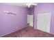 Bedroom with a closet and colorful purple walls at 222 Imperial Ridge Ct, Oviedo, FL 32765