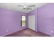 Bedroom with a closet, window, and light purple walls at 222 Imperial Ridge Ct, Oviedo, FL 32765