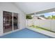 Relaxing outdoor lanai with screened enclosure overlooking the backyard with a white fence at 222 Imperial Ridge Ct, Oviedo, FL 32765
