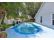 A refreshing backyard pool surrounded by lush landscaping offers a serene and private oasis at 222 Imperial Ridge Ct, Oviedo, FL 32765