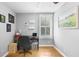 Bright bedroom features hardwood floors, natural lighting and space for a desk and bookshelves at 244 N Leavitt Ave, Orange City, FL 32763