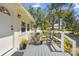 Inviting front porch with a table and chairs, perfect for enjoying the outdoors at 244 N Leavitt Ave, Orange City, FL 32763
