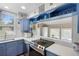 Updated kitchen featuring open shelving, white countertops and stainless steel appliances at 244 N Leavitt Ave, Orange City, FL 32763