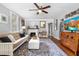 Comfortable living room with hardwood floors, modern decor, and a charming fireplace at 244 N Leavitt Ave, Orange City, FL 32763