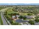Aerial view of the property showcasing its location on a golf course and proximity to amenities at 2500 Castle Pines St, Clermont, FL 34711