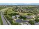 An aerial shot showing the community with golf course, well-manicured lawns, and houses at 2500 Castle Pines St, Clermont, FL 34711