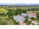 Beautiful aerial shot of a home, situated on a well-maintained golf course at 2500 Castle Pines St, Clermont, FL 34711