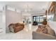 Spacious living room featuring tile floors, comfortable seating, and an open layout at 2500 Castle Pines St, Clermont, FL 34711