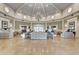 Spacious lobby with a chandelier, comfortable seating, and elegant decor at 2500 Castle Pines St, Clermont, FL 34711