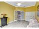 Bright yellow office features wood-look floors and white trim at 2500 Castle Pines St, Clermont, FL 34711