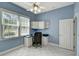 Office space with built-in shelves, a desk, and a bright window offering natural light at 2500 Castle Pines St, Clermont, FL 34711