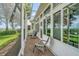 Enclosed patio with brick flooring, chairs, and serene views of the surrounding landscape at 2500 Castle Pines St, Clermont, FL 34711