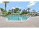 Community pool with clear water, ample seating, and shaded lounging areas at 2500 Castle Pines St, Clermont, FL 34711