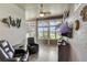 Cozy sun room with large windows offering panoramic views and comfortable seating at 2500 Castle Pines St, Clermont, FL 34711