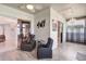 The sunroom features tile floors, recliners, and sliding glass doors at 2500 Castle Pines St, Clermont, FL 34711