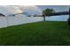 Large, fenced backyard with well-maintained lawn, offering plenty of space for recreation at 2765 Montego Bay Blvd, Kissimmee, FL 34746