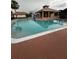 Inviting community swimming pool with a bath house and ample space for lounging at 2765 Montego Bay Blvd, Kissimmee, FL 34746
