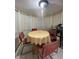 Cozy dining area with a round table, seating, and natural light at 2765 Montego Bay Blvd, Kissimmee, FL 34746